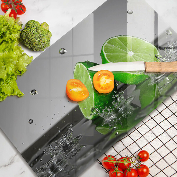Glas Herdabdeckplatte Saftige Limetten und Wasser