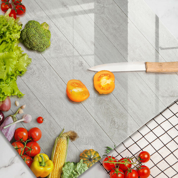 Glas Ceranfeldabdeckung Gemüse auf Brettern