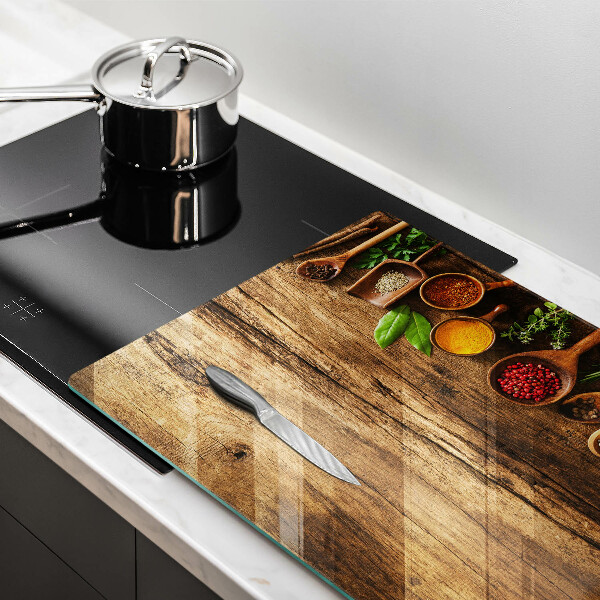 Glas Herdabdeckplatte Holzlöffel mit Gewürzen