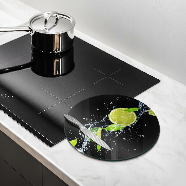 Glas Herdabdeckplatte Saftige Limetten in Wasser