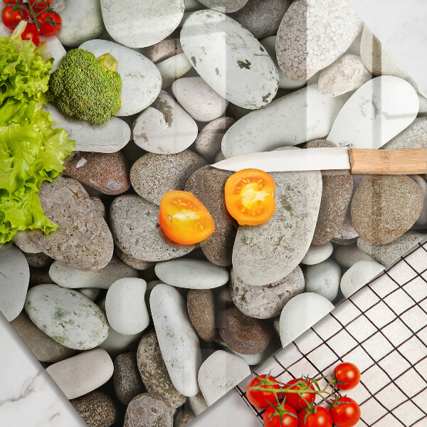 Herdplattenabdeckung Kleine Steine im Hintergrund