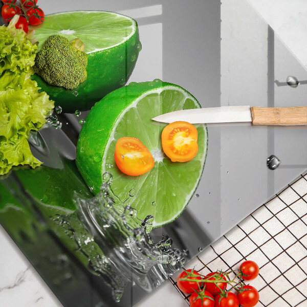 Herdplattenabdeckung Saftige Limetten und Wasser