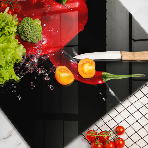 Herdplattenabdeckung Rote Paprika in Wasser