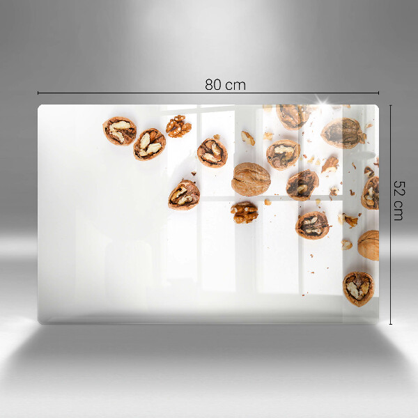 Herdabdeckplatte glas Nüsse auf weißem Hintergrund