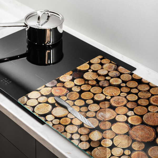 Herdabdeckung Baumstämme