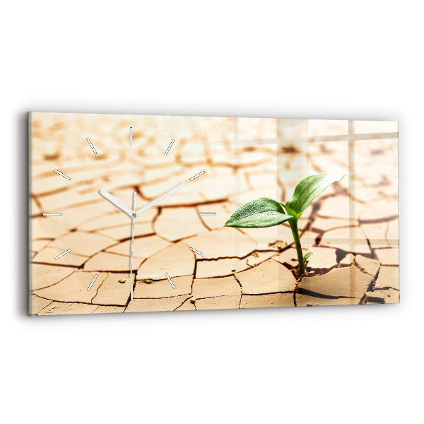 Horizontale Uhr mit motiv Pflanze in getrockneter Erde