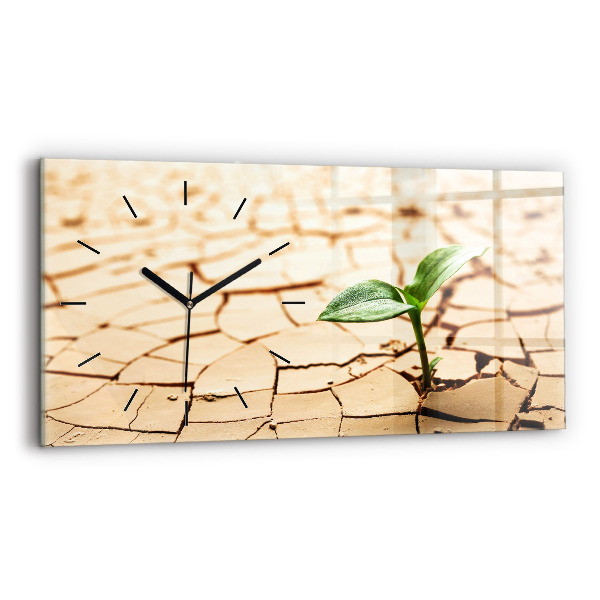 Horizontale Uhr mit motiv Pflanze in getrockneter Erde