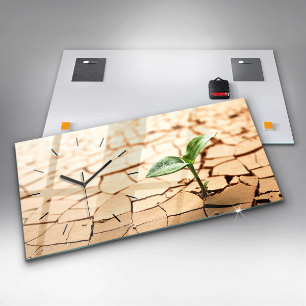 Horizontale Uhr mit motiv Pflanze in getrockneter Erde