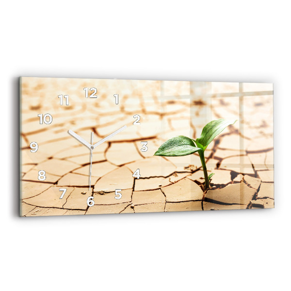 Horizontale Uhr mit motiv Pflanze in getrockneter Erde