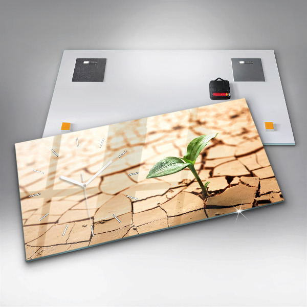 Horizontale Uhr mit motiv Pflanze in getrockneter Erde