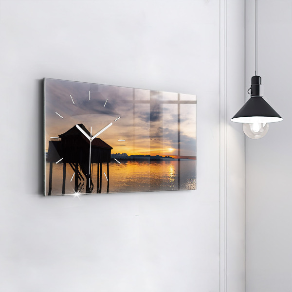 Horizontale Uhr Sonnenuntergang über einem See