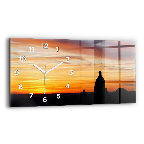Horizontale Uhr Gebäude und Sonnenuntergang
