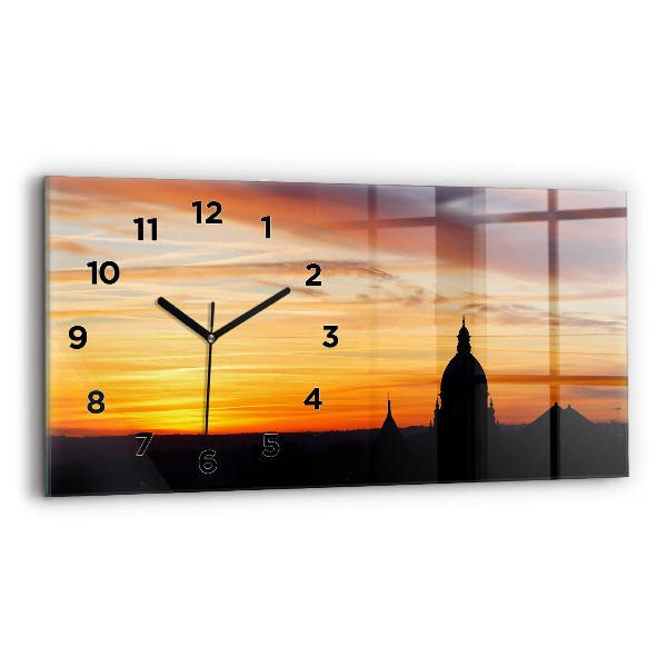Horizontale Uhr Gebäude und Sonnenuntergang