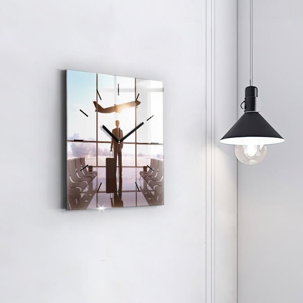 Wanduhr quadratisch Mann auf dem Flughafen