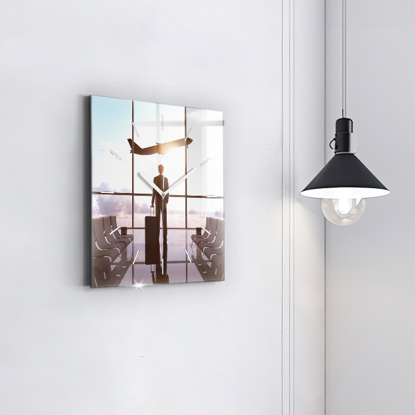 Wanduhr quadratisch Mann auf dem Flughafen