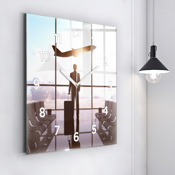 Wanduhr quadratisch Mann auf dem Flughafen