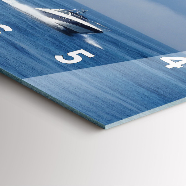 Wanduhr quadratisch Schwimmendes Boot auf dem Meer