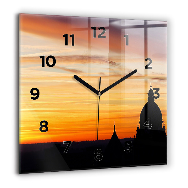 Wanduhr modern quadratisch Gebäude und Sonnenuntergang
