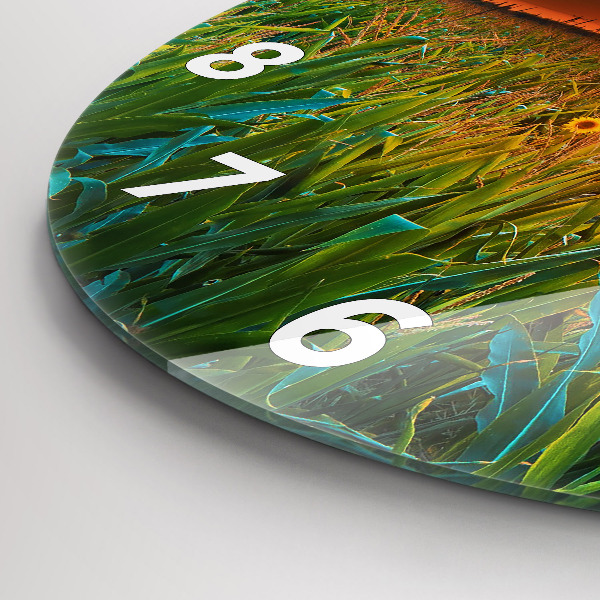 Wanduhr rund Sonnenblumen auf einer Wiese