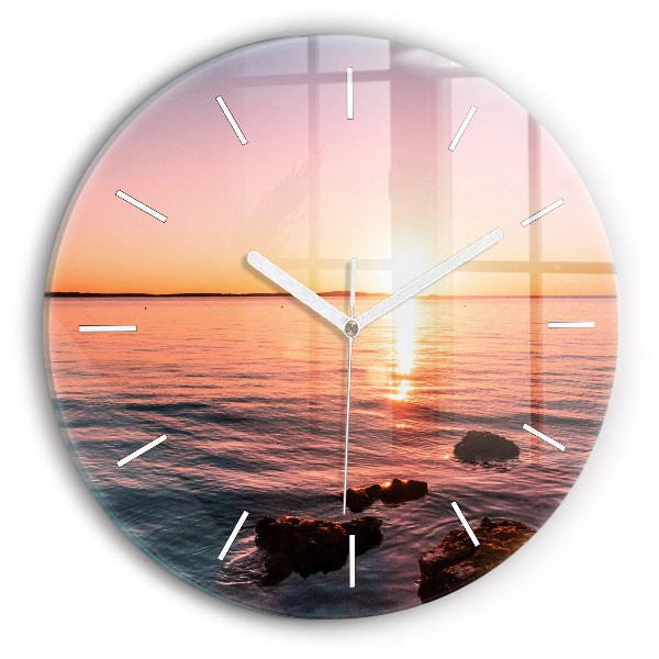 Wanduhr glas rund Felsen bei Sonnenuntergang