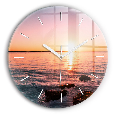 Wanduhr glas rund Felsen bei Sonnenuntergang
